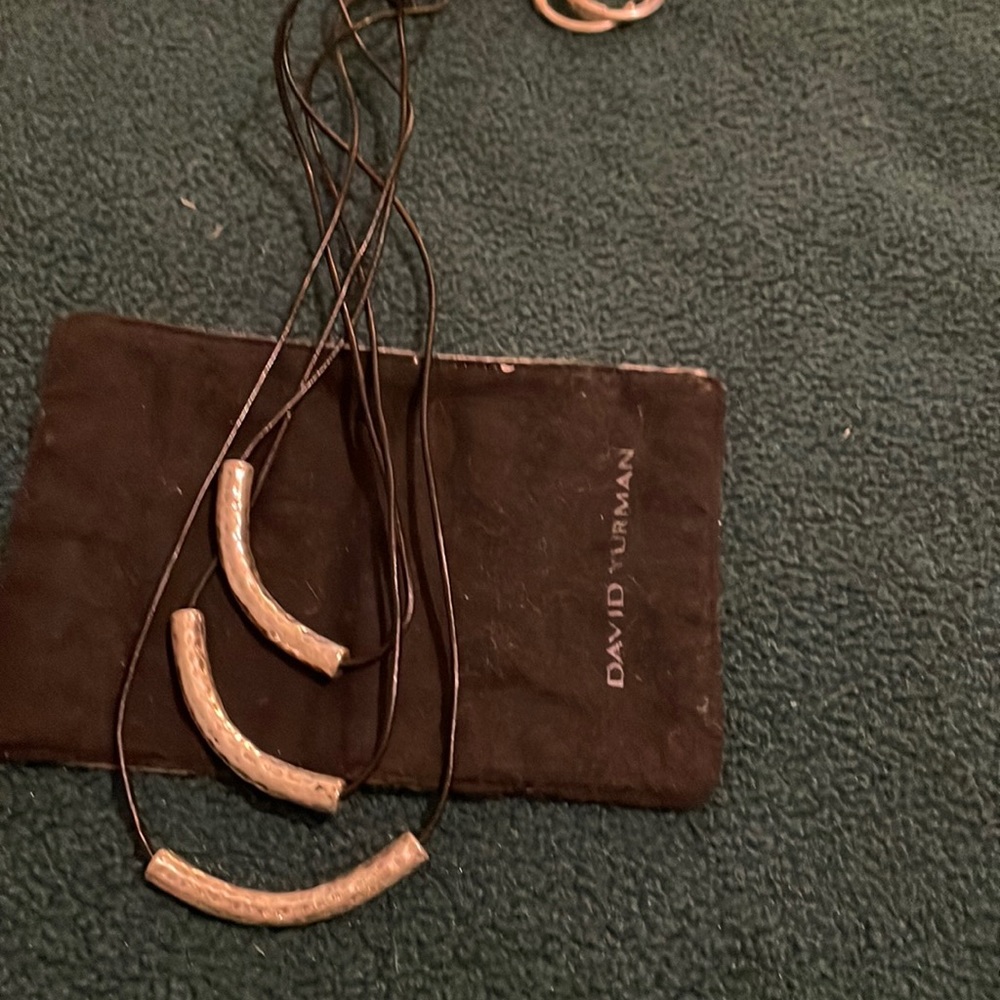 Necklace with thin cord and silver sleeves